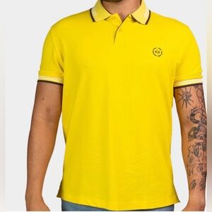 yellow polo shirt by IZOD featuring a contrasting collar and cuffs.